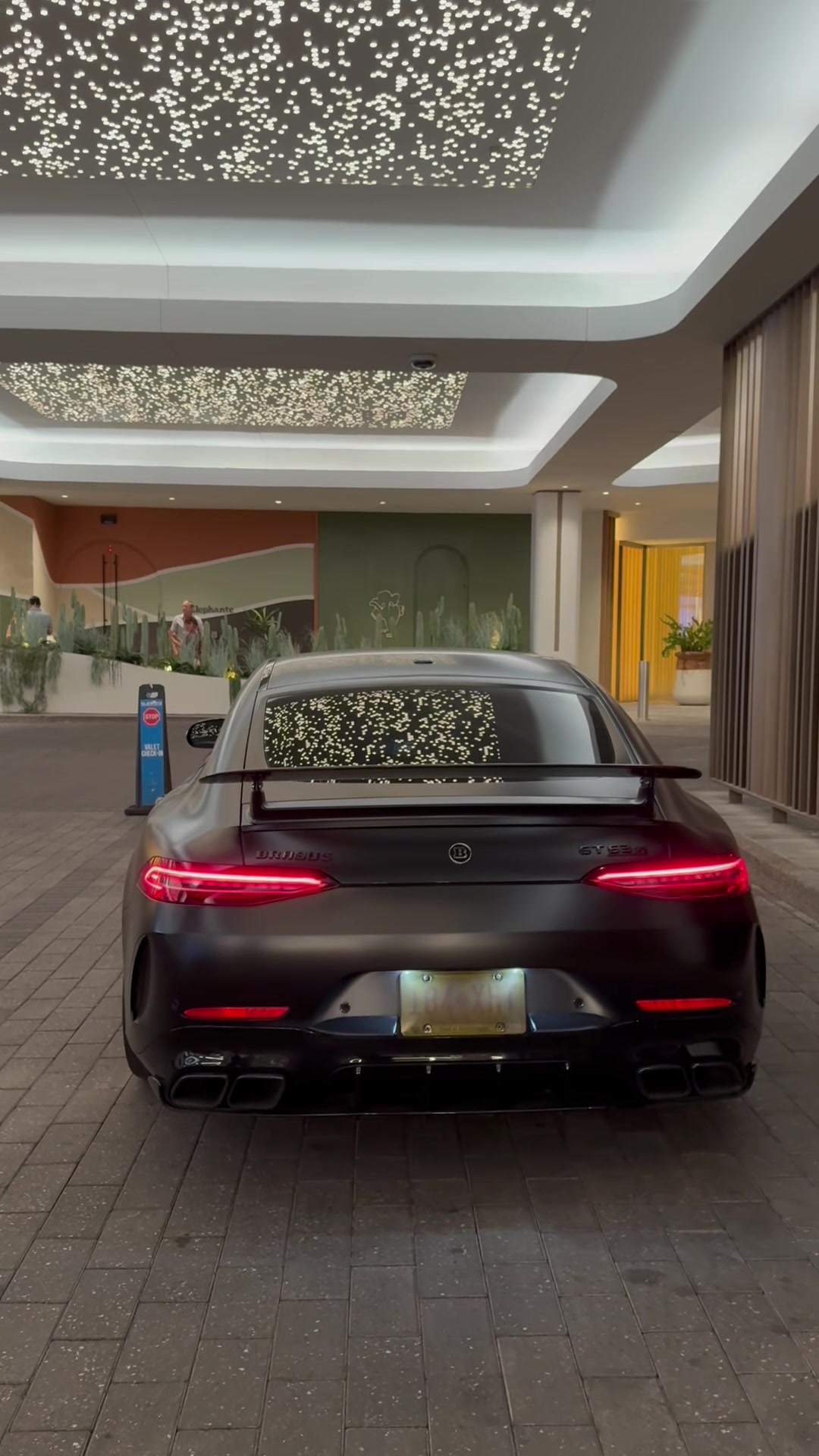 Rear three-quarter view of the matte black GT 63 S
