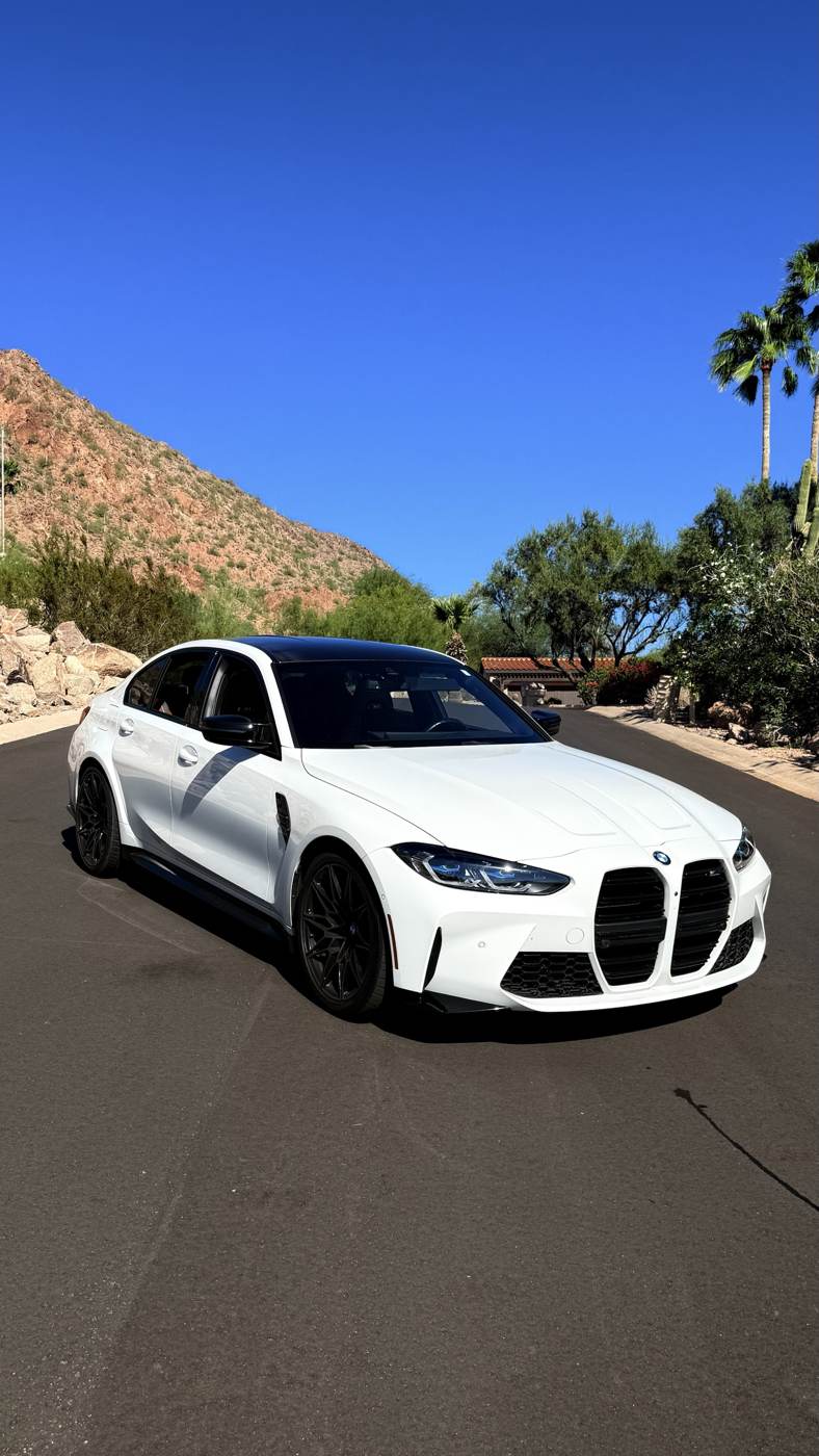 White BMW M3 Competition in front of Camelback Mountain